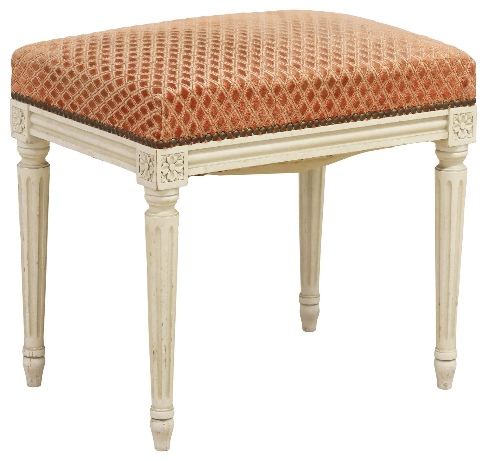 FRENCH LOUIS XVI STYLE PAINTED & UPHOLSTERED OTTOMAN: French Louis XVI style white-painted ottoman/ footstool, early 20th c., having padded seat in patterned fabric upholstery, with nailhead trim, rising on fluted tapering legs, ending on toupie feet,