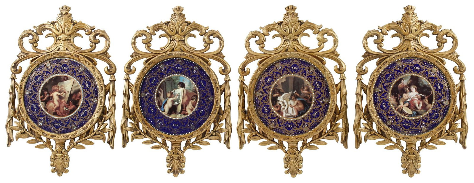 (4) ROYAL VIENNA STYLE FRAMED COBALT PORCELAIN CHERUB PLAQUES: (lot of 4) Royal Vienna style framed porcelain plaques, each having enameled cobalt trim, centering transfer-printed images of cherubs engaged in artistic endeavors, housed in a pierced gilt-painted