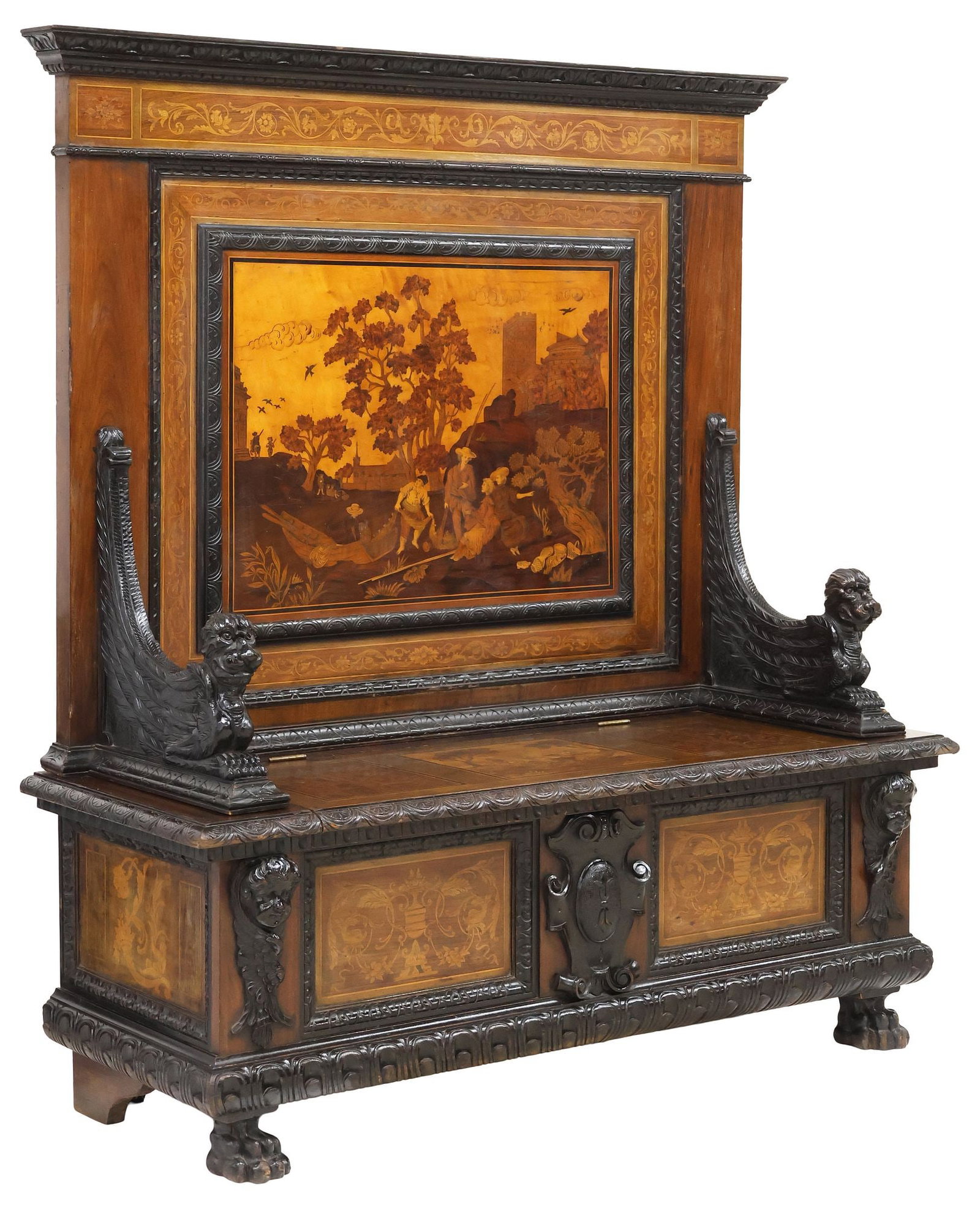FINELY INLAID ITALIAN RENAISSANCE REVIVAL CARVED WALNUT HALL BENCH: Italian Renaissance Revival inlaid walnut hall bench, 19th c., paneled back inlaid with fine marquetry figural landscape, sloping armrests with protruding beasts, hinged seat with further inlay of
