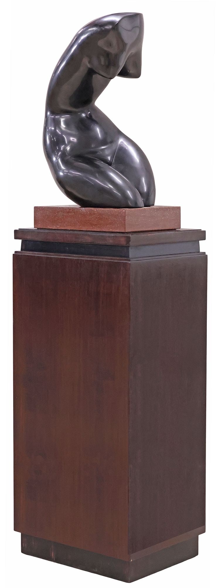 CHARLES UMLAUF (1911-1994) MARBLE SCULPTURE ON PEDESTAL, FEMALE TORSO, 68"H: Carved Belgian black marble sculpture, Female Torso, signed C. Umlauf (Charles Umlauf, American, active in Austin, Texas, 1911-1994), on an integral red granite plinth, further raised on a rectan