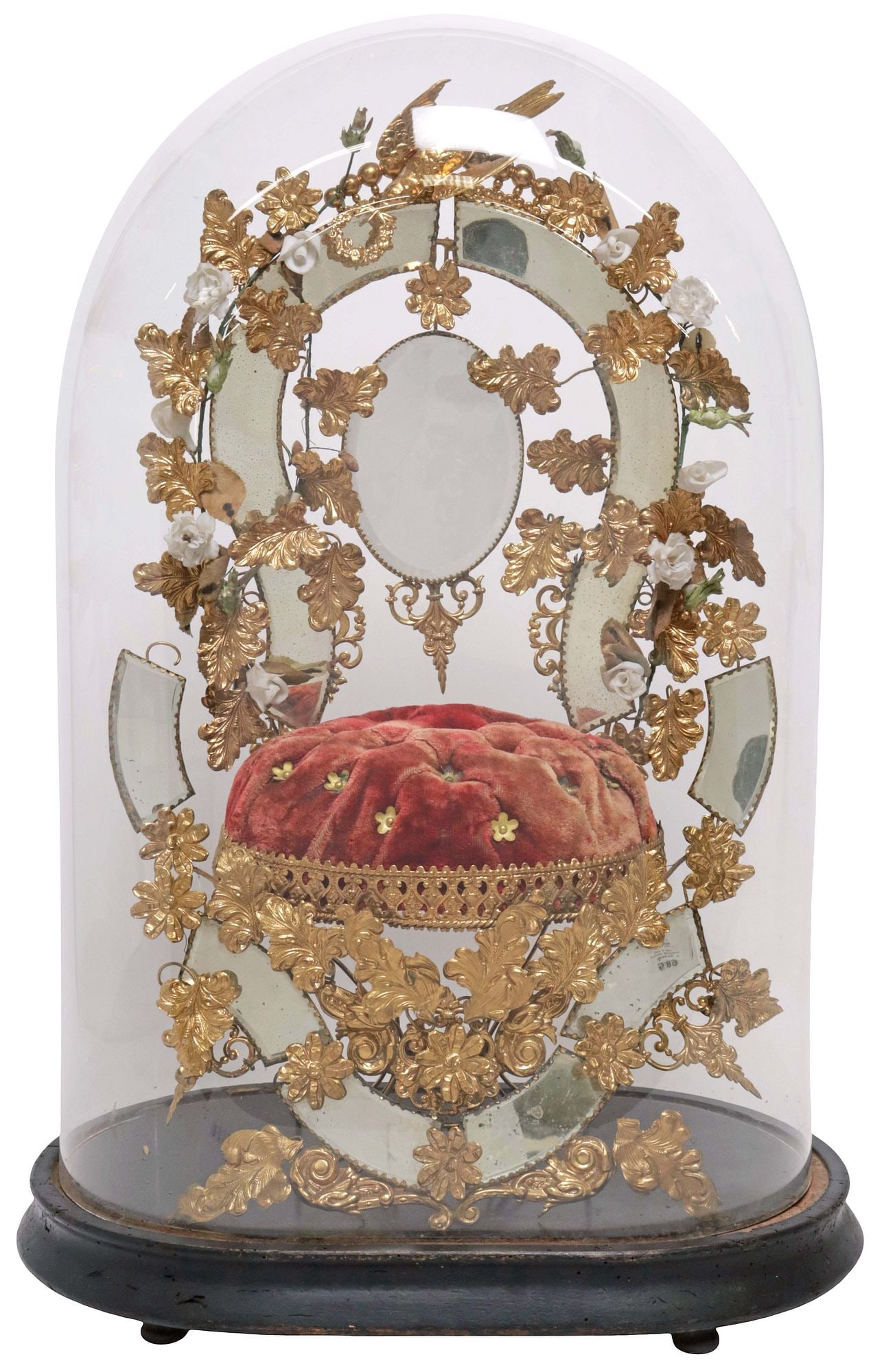 FRENCH GLOBE DE MARIEE / BRIDE'S GLOBE IN GLASS CLOCHE: French globe de mariee/ bride's globe, late 19th c., glass cloche/ dome on ebonized base, enclosing gilt metal frame, with flowers and small mirror plates on red tufted cushion, approx 21.5"h, 14"w,