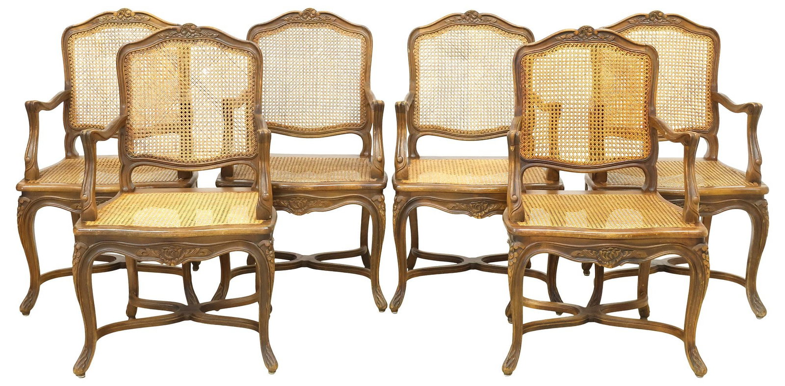 (6) FRENCH LOUIS XV STYLE CANED WALNUT ARMCHAIRS / FAUTEUILS: (lot of 6) Louis XV style walnut fauteuils/ armchairs, 19th c., each with fanned floral crest, above caned back and seat, on stretcher-joined cabriole legs, ending on carved acanthus feet, (one) with