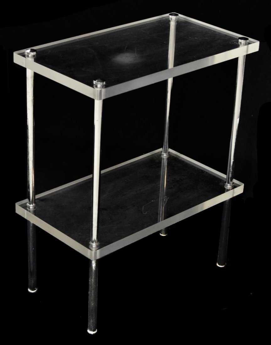 ITALIAN MODERN PLEXIGLASS SIDE TABLE: Italian modern side table, 1980's, two plexiglass tiers joined by chrome metal supports, some scratches, 21.5"h, 17.75"w, 9.75"d Start Price: $80.00