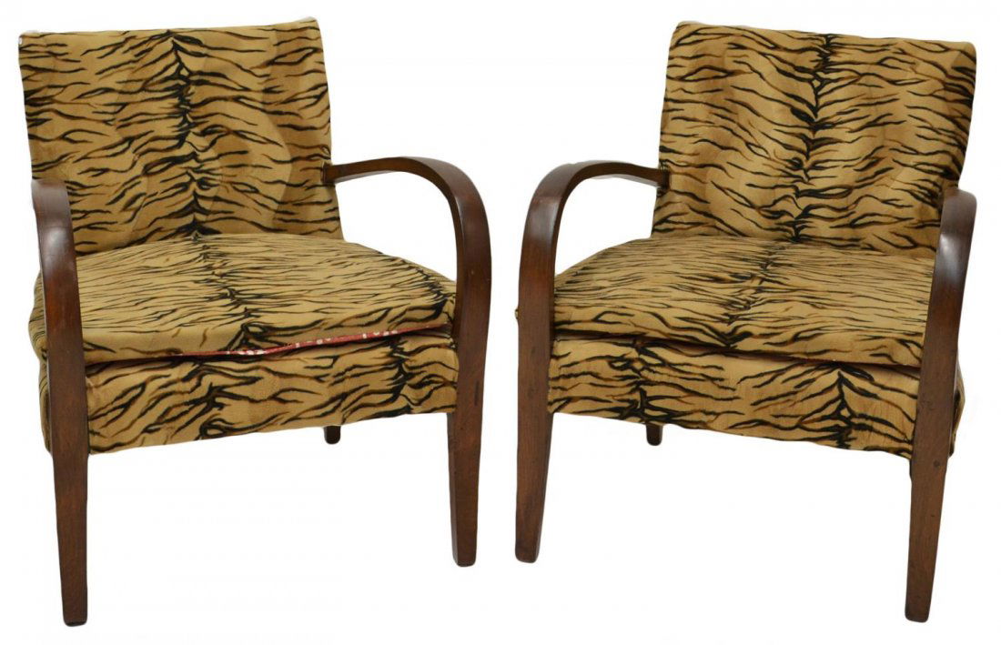(PAIR) ITALIAN ART DECO UPHOLSTERED ARM CHAIRS: (pair) Italian Art Deco arm chairs, c. 1930’s, each having contiguous curved arm rest, padded back and loose cushion seat, animal print upholstery, 30.5”h, 25.75”w, 24.25”d Start Price: $150.0
