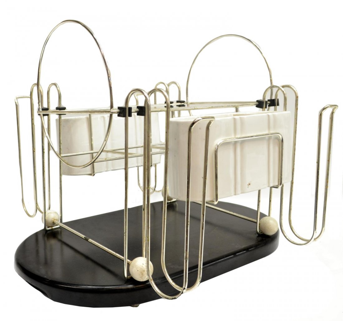 ITALIAN MID-CENTURY MODERN DISH DRYING RACK: Italian design dish drying rack, c. 1960's, metal framing with individual spaces for various dishes, two white ceramic compartments for silverware, on wood base, rack: 13"h, 14.75"w, 19.25"d, overall: