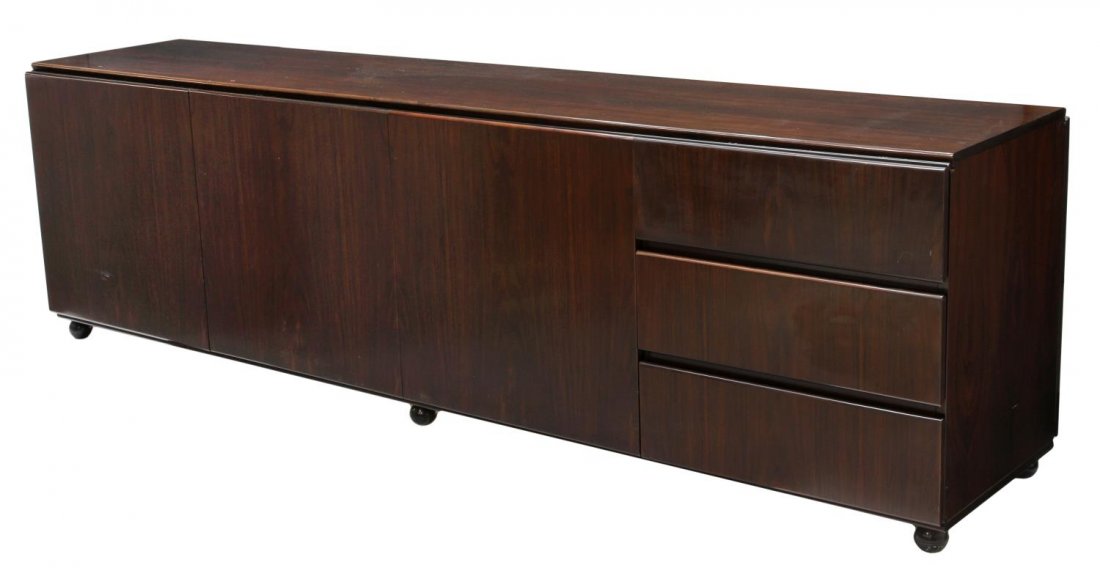 ITALIAN ROSEWOOD SIDEBOARD, CLAUDIO SALOCCHI: Italian modern rosewood sideboard, Claudio Salocchi (Italian, b. 1934) for Sormani, Italy, c. 1970, rectangular with three drawers and three doors, rising on ball feet, 27.75"h, 94.75"w, 19.5"d Start