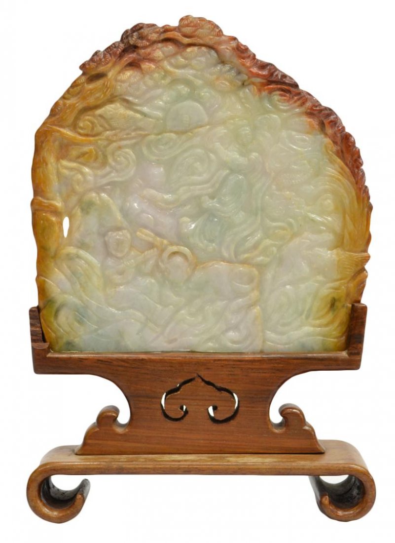 CHINESE RELIEF CARVED JADEITE TABLE SCREEN: Chinese jade/jadeite small table screen, carved and mountain wreathed in clouds, reversed by celestial figures in a cloudy landscape, the edges incorporating the russet-hued skin, 6 fissures throughou