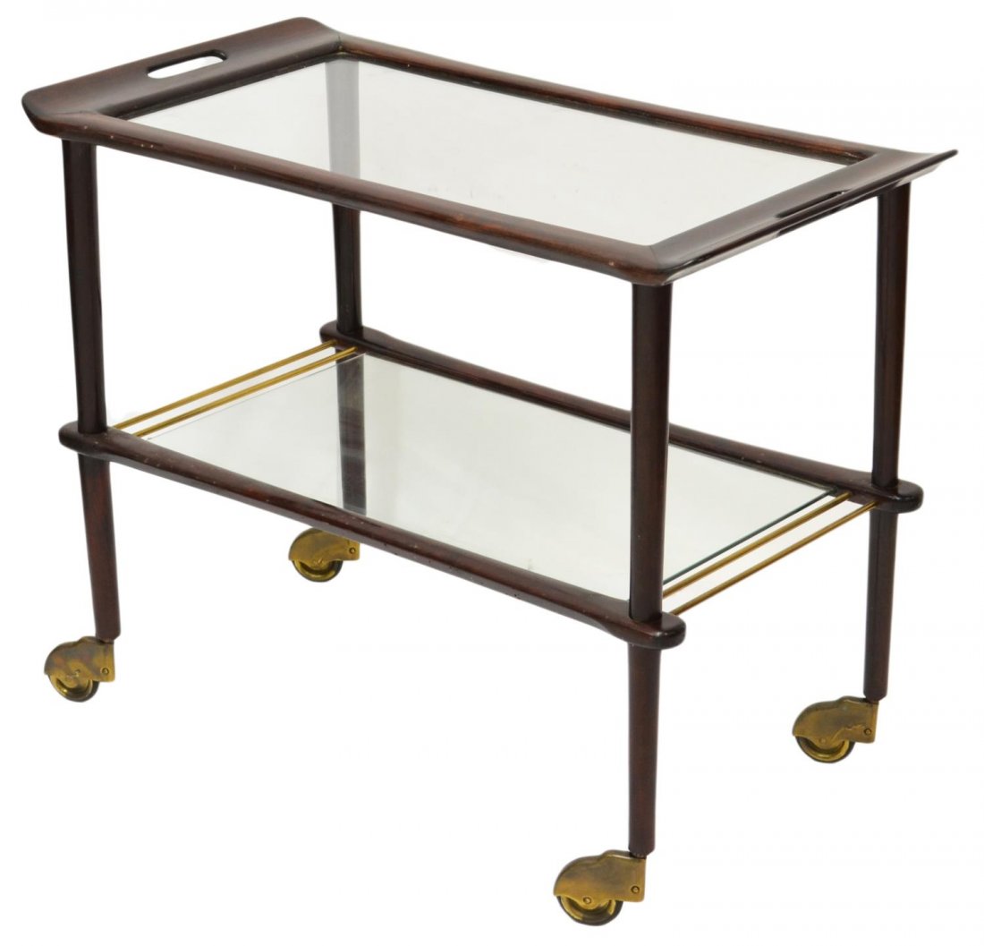 ITALIAN TWO-TIER SERVICE TROLLEY, 1940'S: Italian rolling service cart, designed in the 1940's, two glazed tiers moving on large wheels, handled upper section, some surface wear with age, approx 25.5”h, 31.5”w, 17.25”d Start Price: $100