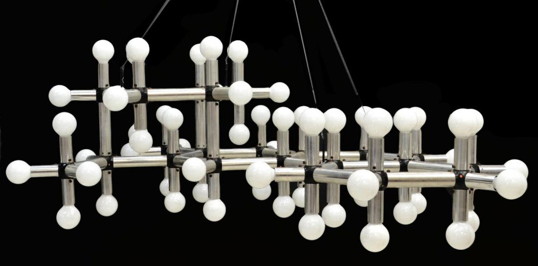 MID-CENTURY 'ATOMIC ATOM' CHANDELIER, HAUSSMANN: Modular double ring hanging light structure, Atomic Atom, attributed to Robert Haussmann for Swiss Lamp International , c. 1960's, chromed metal tubes form the modular fixture terminating in numerous