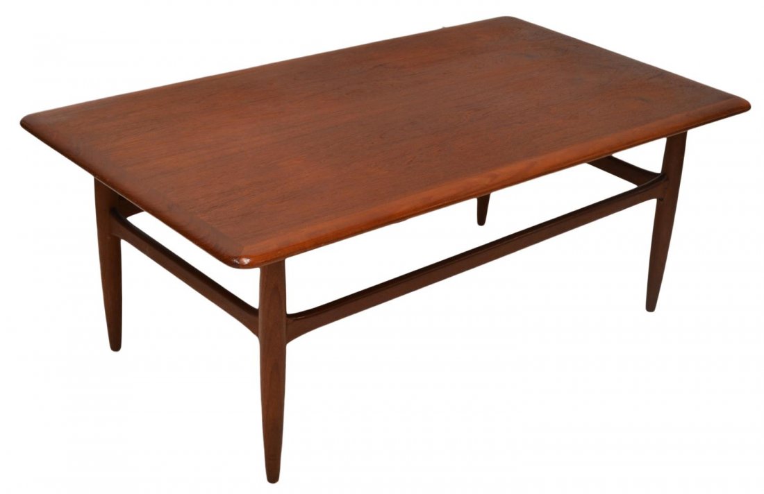 DANISH MID-CENTURY MODERN TEAKWOOD SIDE TABLE: Danish mid-century modern teakwood coffee table, rectangular with round tapered legs joined by stretchers, wood chips at stretcher, retaining tag, 20"h, 50.5"w, 29"d Start Price: $150.00