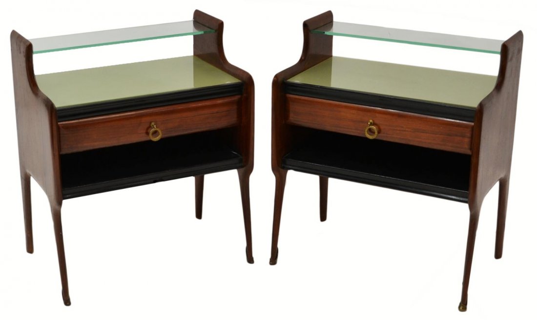 (2) ITALIAN 1930'S MODERN NIGHT STANDS: (lot of 2) Italian modern walnut bed side cabinets, 1930's, glass shelf over the green glass top, a single front drawer over an open shelf, rising on splayed front legs, on upper shelf with chip to ba