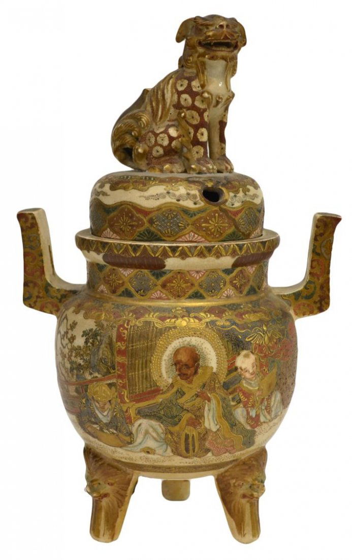 SATSUMA GILT & ENAMEL TRIPOD CENSER, MEIJI PERIOD: Satsuma gilt and enamel decorated earthenware tripod incense burner with figural decoration, Meiji period, loss to fu dog’s tail, 11.25”h, 2.5lbs Start Price: $80.00