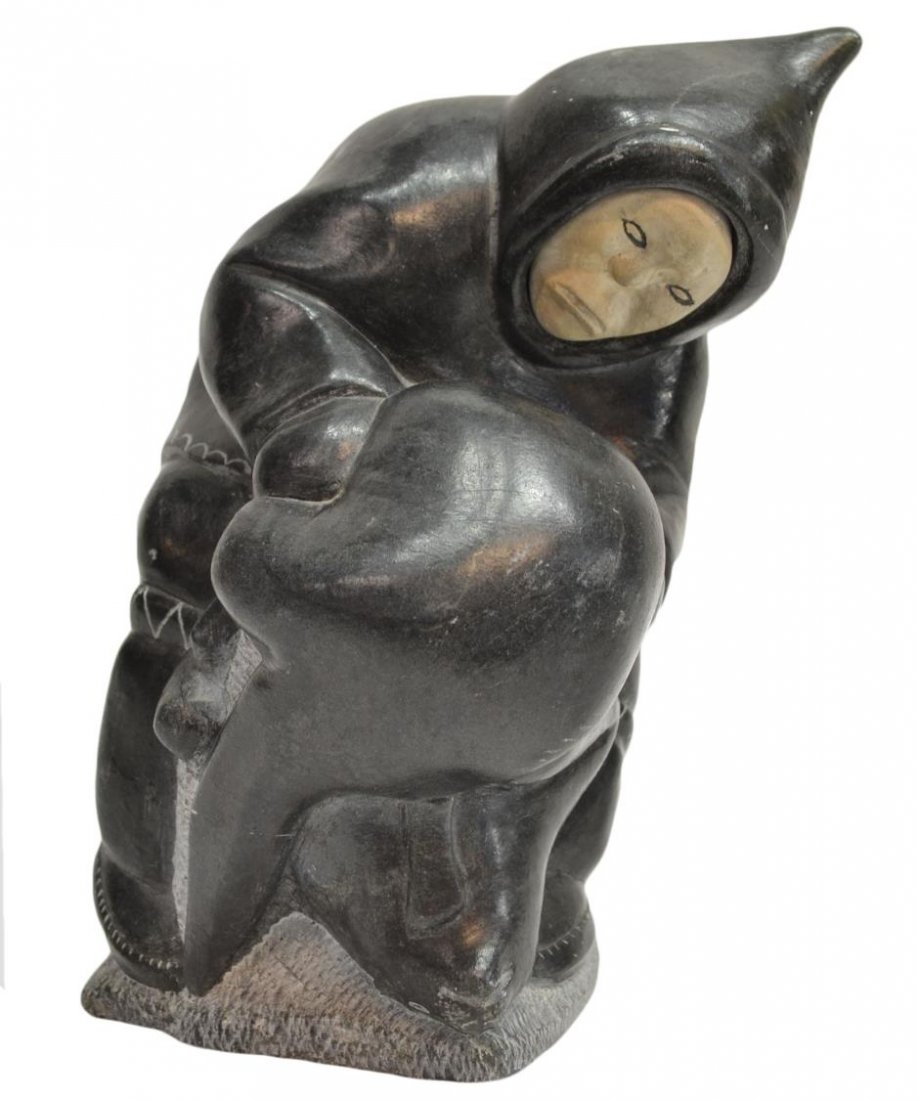 INUIT STONE CARVING, ESKIMO & BEAR, C. 1978: Inuit stone figural group, an Eskimo handling a bear, white stone face, some surface scratches, dated 1978 with additional numbers and tags underfoot as pictured, approx 8.5"h, 5.25"w, 4.5"d, 11.5lbs 