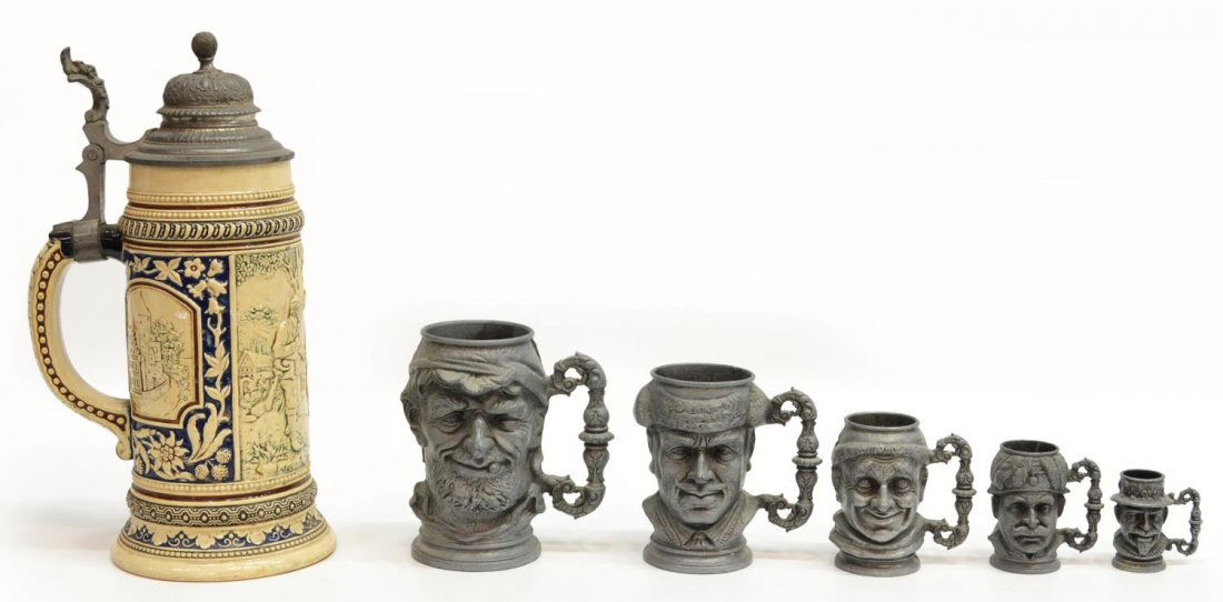 (6) VINTAGE FIGURAL PEWTER & CERAMIC BEER STEINS: (lot of 6) Collection of figural steins, 20th c., comprising: (5) graduated pewter mugs in the form of heads, some splitting, largest: 5.25"h; (1) ceramic stein, figural reserve in relief, enclosed by