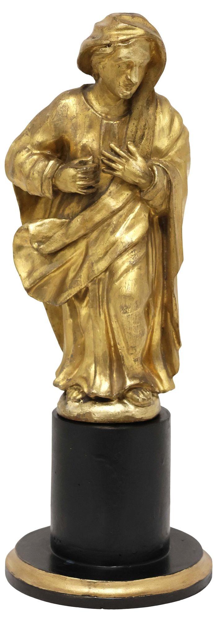 CONTINENTAL CARVED GILTWOOD SCULPTURE OF THE MADONNA ANNUNCIATE: Continental giltwood religious sculpture, possibly Flemish, 19th c., gesso over carved wood, modeled as the Virgin Annunciate, cloaked in robes with hands held at the chest, on black-painted pedestal 
