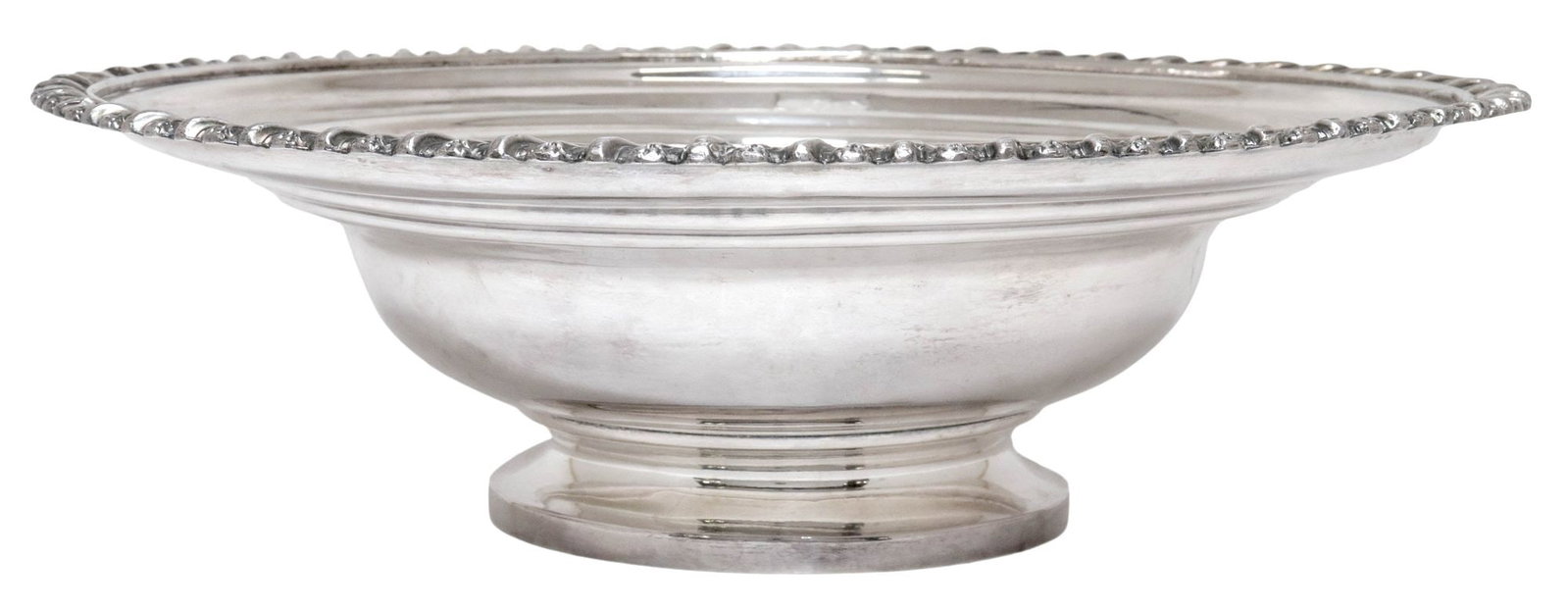 LARGE SCALLOPED SILVER CENTERPIECE BOWL WITH ARMORIAL CREST: Silver (content unknown) footed centerpiece bowl, with gadrooned trim, armorial motif in shield-form cartouche, partially-obliterated hallmarks underfoot, approx 3.75"h, 12.25"diam, 24.72ozt **Provena
