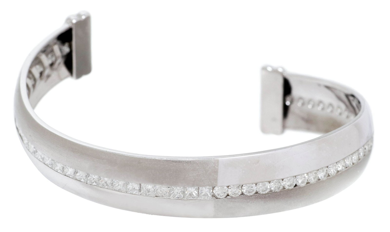 ESTATE PLATINUM & 6.30CTTW DIAMOND BANGLE BRACELET: Estate platinum (tested) bangle bracelet, central channel-set band of (thirty) round brilliant-cut diamonds, and (twenty-nine) princess-cut diamonds, approx 6.30cttw, average color: G-H, average clari