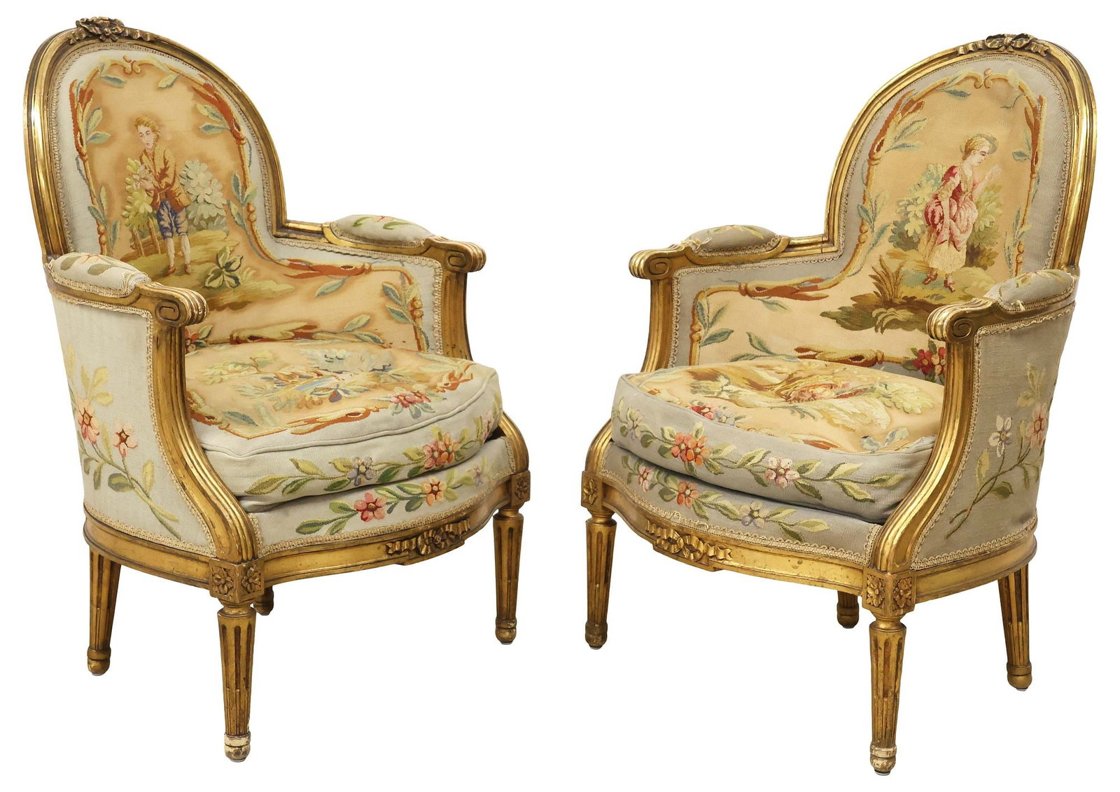 (2) FRENCH LOUIS XVI STYLE TAPESTRY-UPHOLSTERED GILTWOOD ARMCHAIRS: (pair) French Louis XVI style giltwood armchairs/ bergeres, early 20th c., each in tapestry upholstery with pastoral figures and animals, with removable down-filled seat cushion, on tapering fluted le