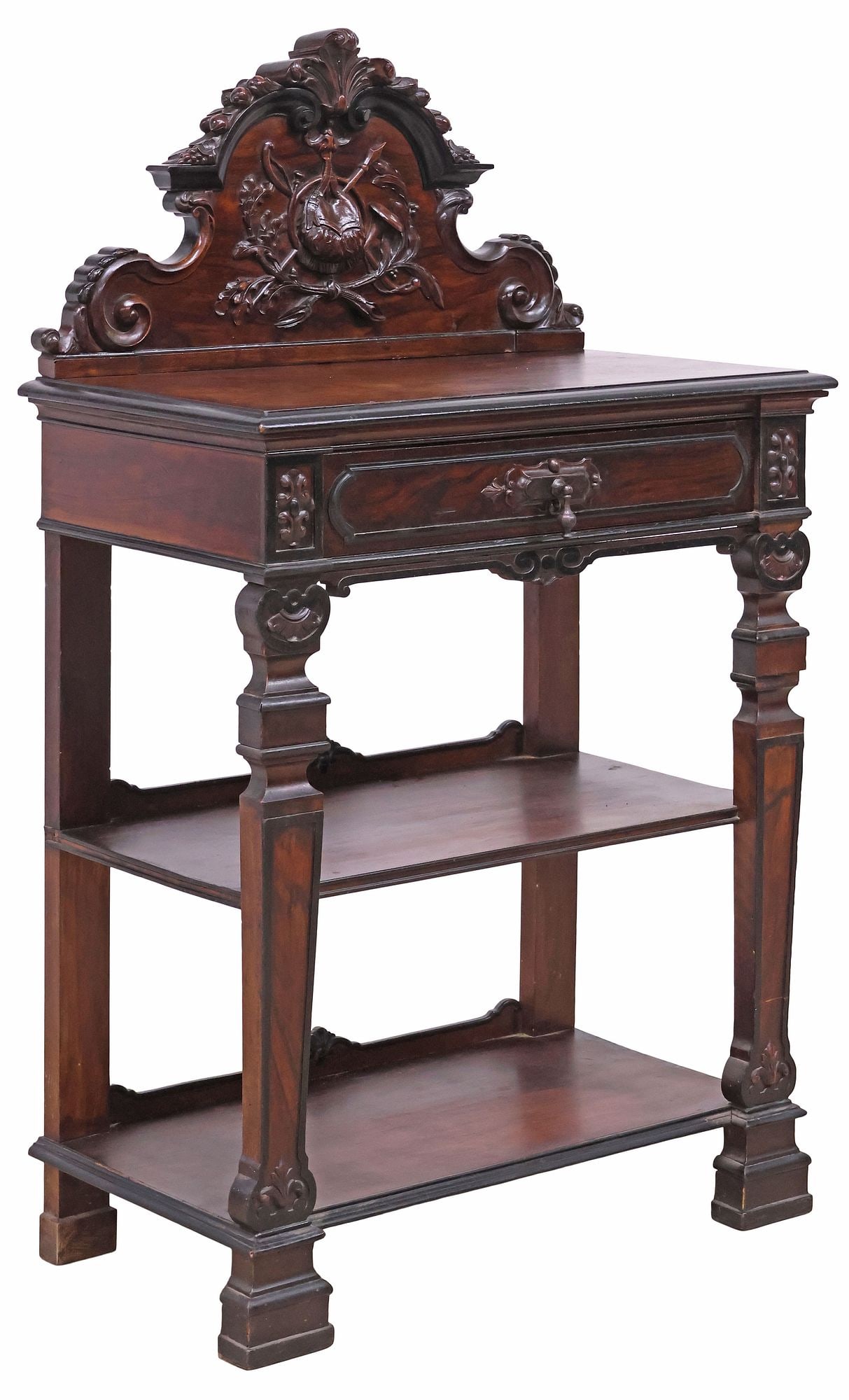 SPANISH ALFONSINO PERIOD CARVED WALNUT TIERED SERVER: Spanish Alfonsino carved walnut tiered server, late 19th c., with scrolling crest, above rectangular top and single drawer, tapered legs joined by two medial shelves, ending on stepped block feet, app