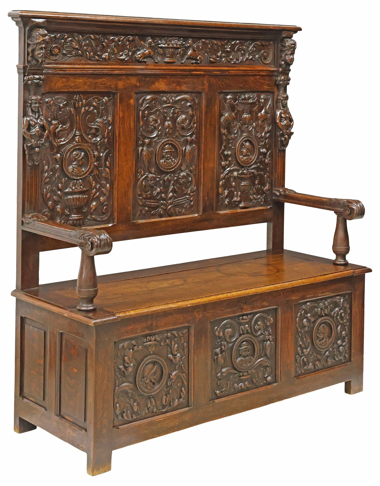 FRENCH RENAISSANCE REVIVAL CARVED OAK HALL BENCH: French Renaissance Revival carved oak hall bench, late 19th c. having paneled back with portrait roundels and foliate scrollwork, framed by half figures, over hinged seat with open interior storage, o
