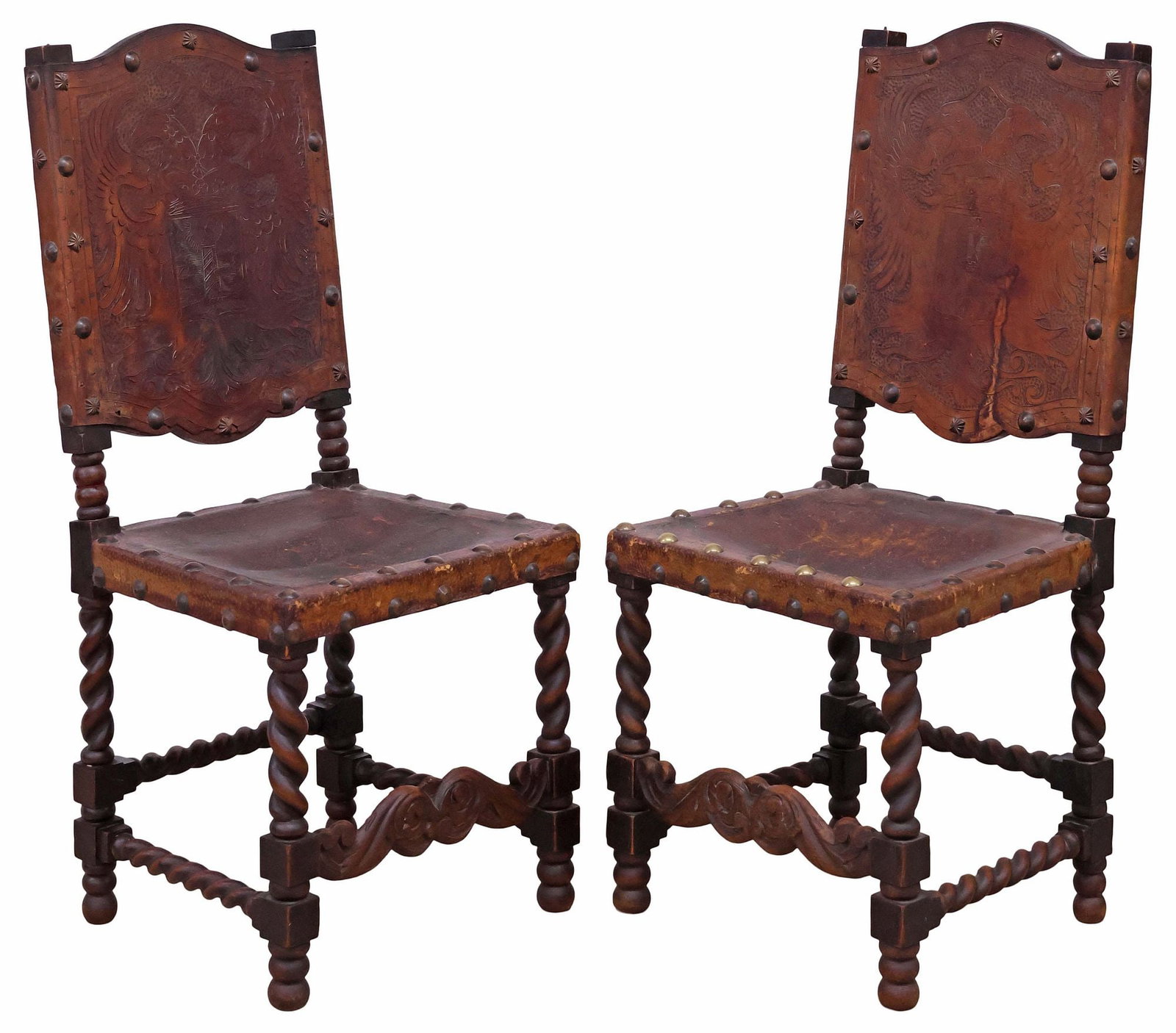 (2) SPANISH BAROQUE STYLE EMBOSSED LEATHER SIDE CHAIRS: (pair) Spanish Baroque style side chairs, 19th c., having raised stiles, tooled leather back with heraldic double-headed eagle centering a crown and shield, plain seat, over stretcher-joined spiral-tw
