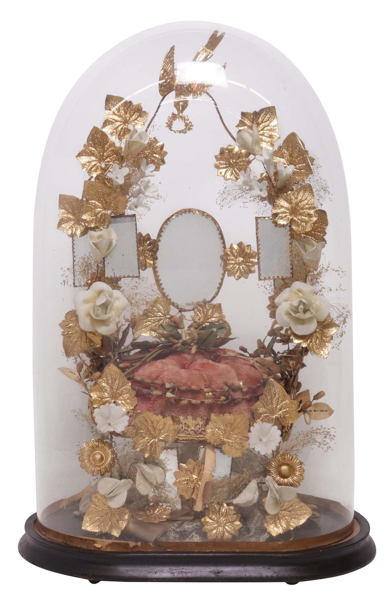 FRENCH GLOBE DE MARIEE / BRIDE'S GLOBE IN GLASS CLOCHE: French globe de mariee/ bride's globe, late 19th c., glass cloche/ dome on ebonized base, enclosing porcelain flowers, gilt-metal foliates, and beveled mirror plates on tufted cushion, approx 20"h, 13