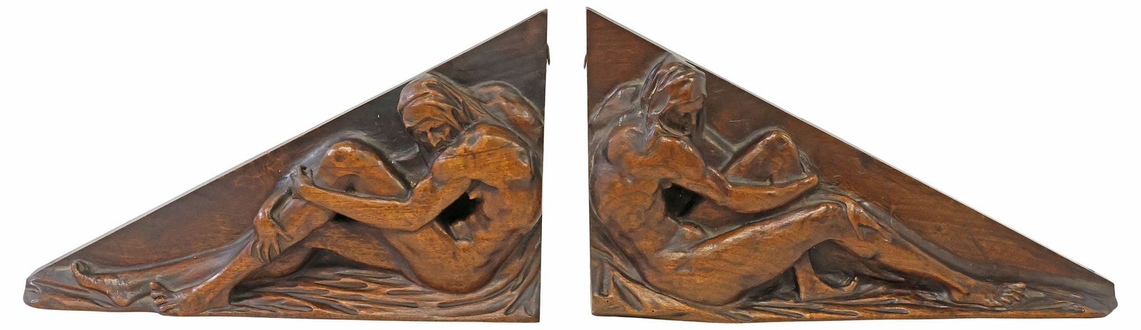 (2) SPANISH CARVED WALNUT ARCHITECTURAL ELEMENTS WITH SEATED FIGURES: (lot of 2) Spanish carved walnut architectural gable ends or pediment components, early 20th c., each of triangular form, with opposing seated figure in high relief, approx 11.75"h, 20"w, 2.5"d, 6.25l