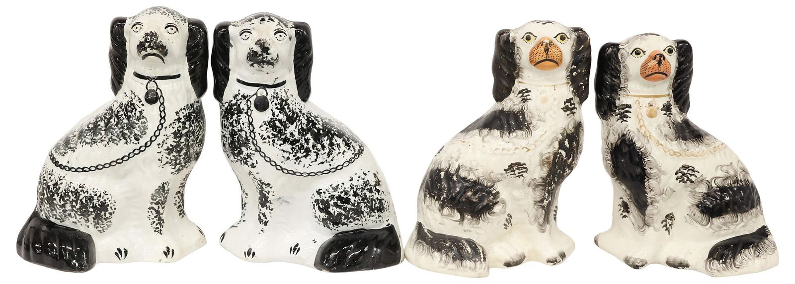 (4) ENGLISH VICTORIAN STAFFORDSHIRE DISRAELI MANTEL DOGS: (lot of 4) English Victorian Staffordshire mantel dogs, late 19th c., comprising two pairs, each modeled as a seated Disraeli spaniel, with painted features and black fur, (two) with remnants of parce