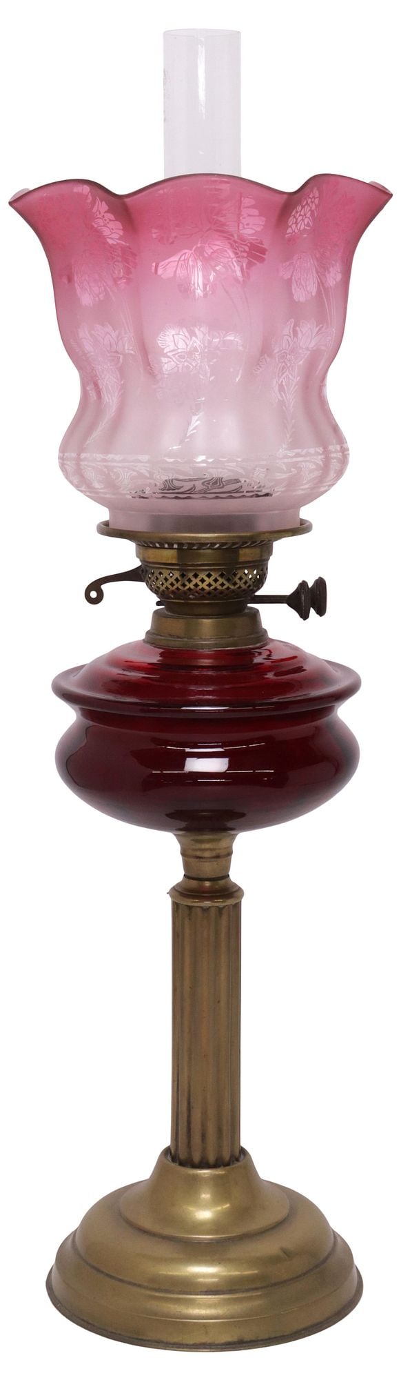 ENGLISH VICTORIAN RUFFLED CRANBERRY & RUBY GLASS OIL LAMP: English Victorian brass and glass oil lamp, late 19th c., having flared and ruffled glass shade, in an ombre finish with etched floral motifs, over ruby glass oil reserve, rising on fluted columnar br