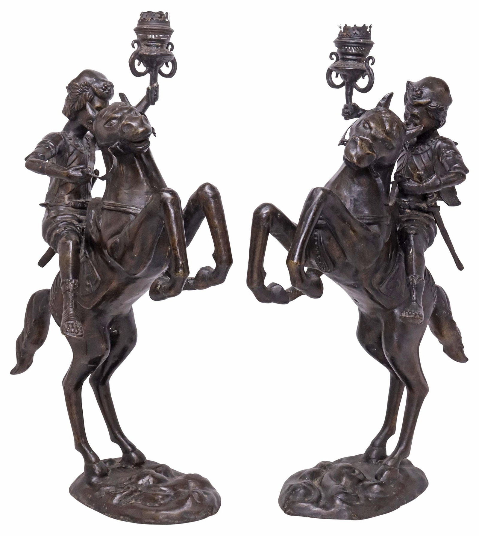 (2) PATINATED SPELTER SCULPTURAL RIDER ON HORSEBACK CANDLESTICKS, 31"H: (pair) Large patinated spelter sculptural candlesticks, each modeled as a Renaissance-style rider on rearing horse, holding torch-form bobeche aloft, on integral naturalistic base, approx 31.25"h, 18"