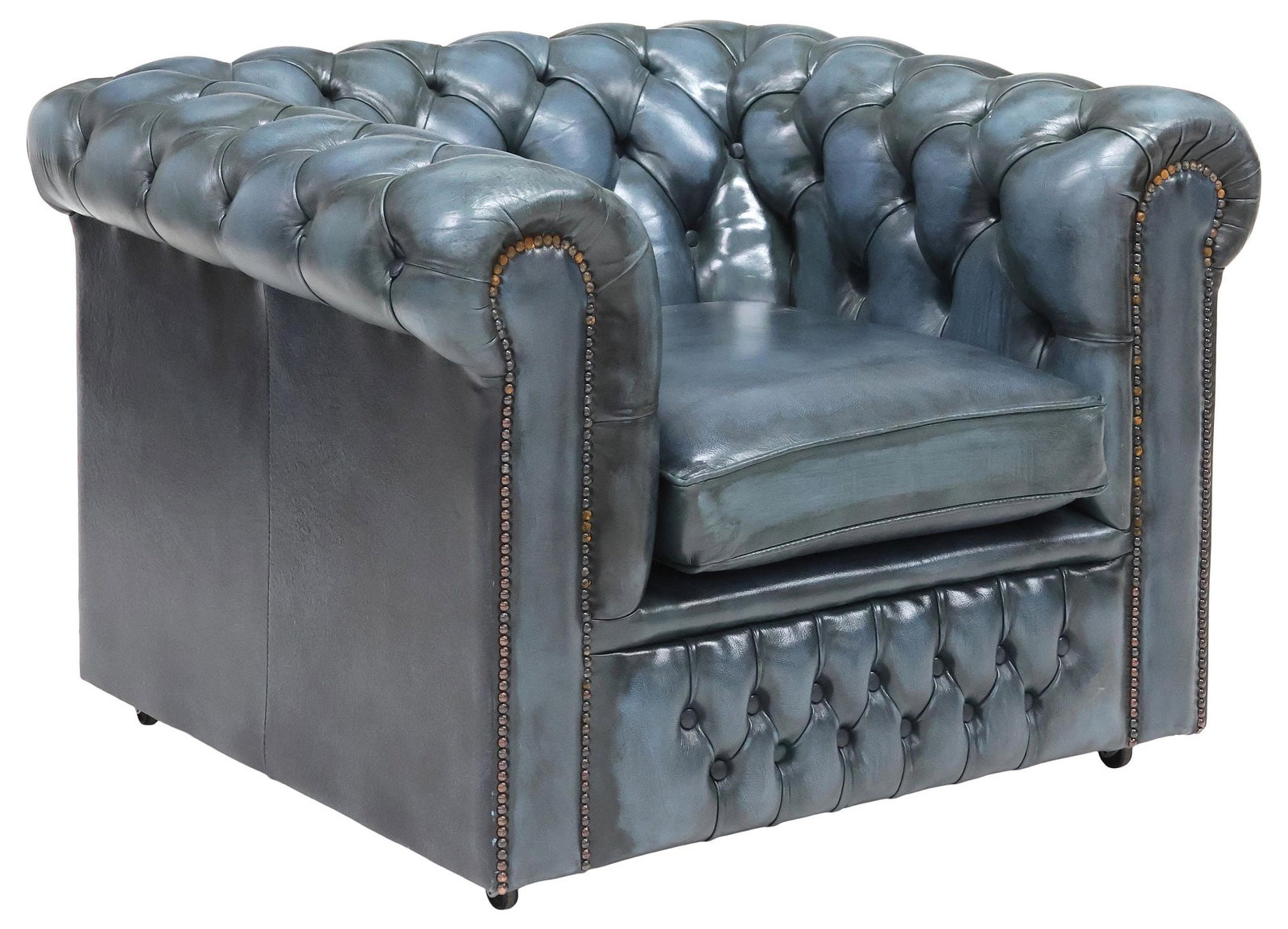 ENGLISH CHESTERFIELD STYLE BUTTONED BLUE LEATHER CLUB CHAIR: English Chesterfield style club chair, late 20th c. in a button-tufted mottled blue leather upholstery, with nail-head trim, having rolled back and arms, and removable seat cushion, rising on casters,