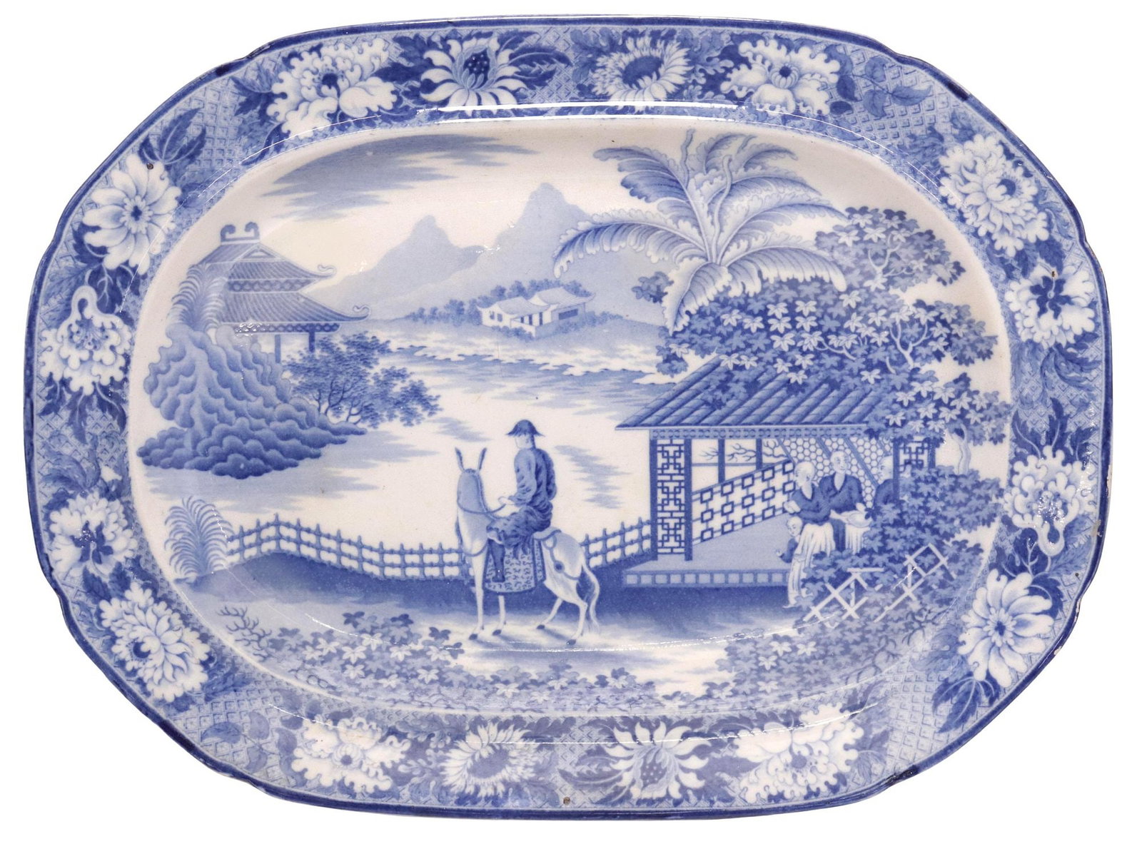 ENGLISH STAFFORDSHIRE BLUE & WHITE CHINOISERIE TRANSFERWARE PLATTER: English Staffordshire blue and white transferware platter, 19th c., depicting a chinoiserie landscape with central figure on a mule, foliage and pagodas in the background, impressed numeral 20 underfo