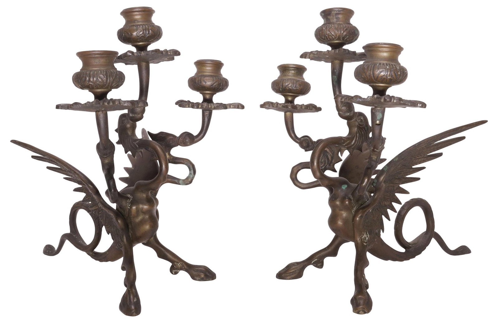 (2) PATINATED BRONZE FIGURAL WINGED DRAGON 3-LIGHT CANDELABRA: (pair) Patinated bronze three-light candelabra, figural standard in the form of a winged three-headed dragon, each head issuing shaped bobeche, approx 11.25"h, 8"w, 11.5"d, 11.5lbs total