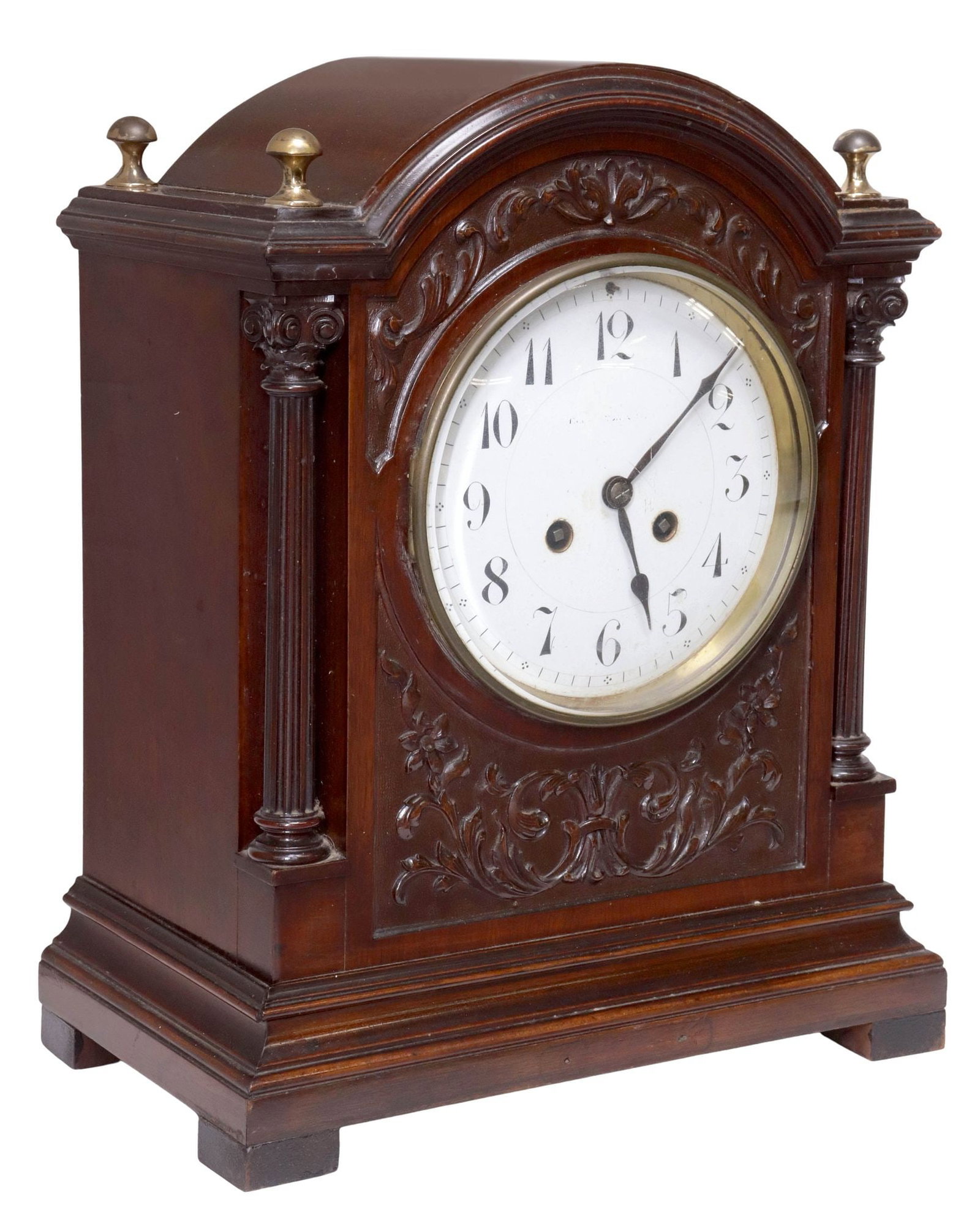 ENGLISH VICTORIAN CARVED MAHOGANY MANTEL SHELF CLOCK: English Victorian mahogany mantel clock, late 19th c., arched architectural case with carved foliate scrollwork, fluted columnar posts topped by Corinthian capitals, centering white dial with Arabic h
