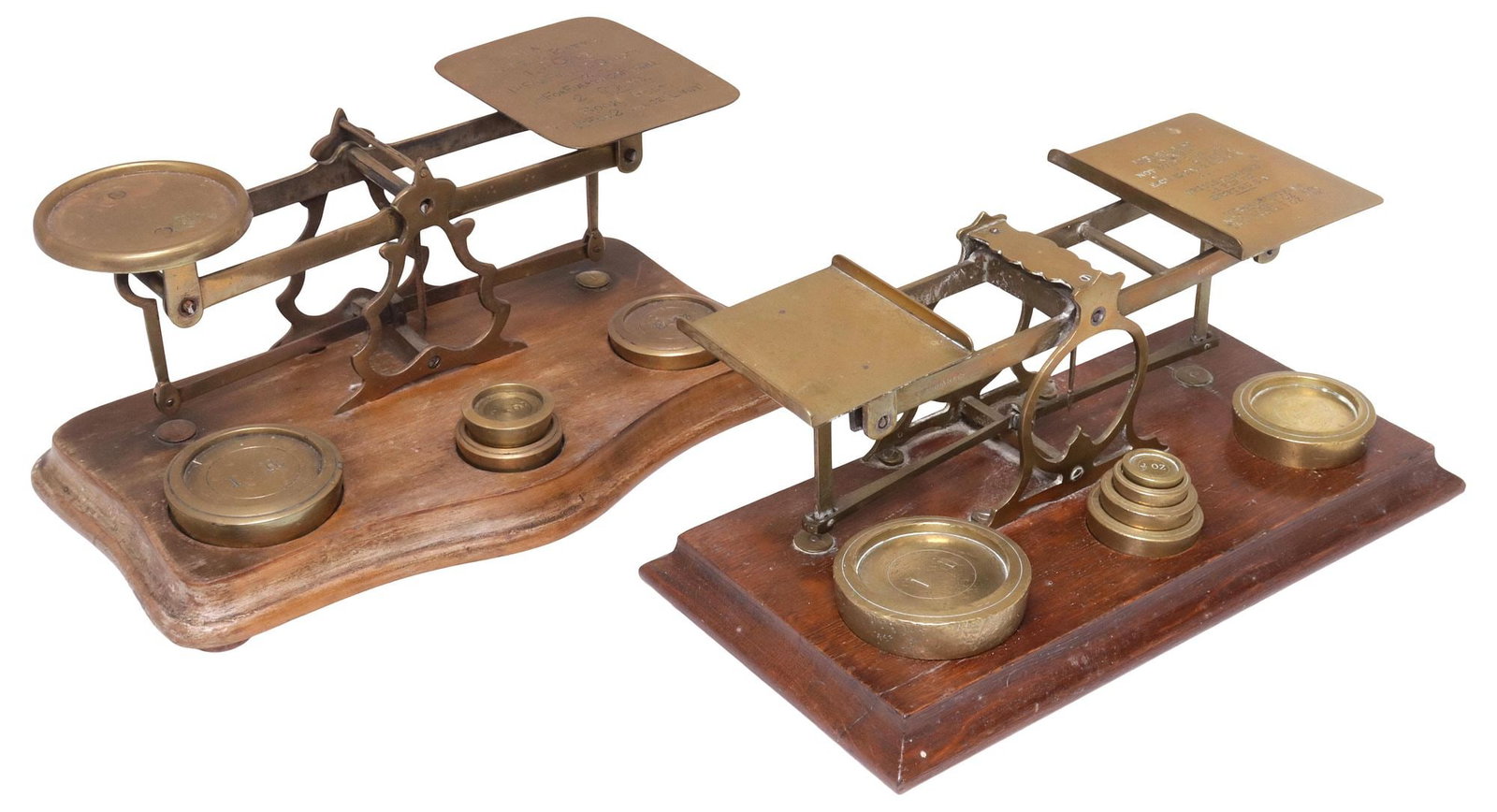 (2) ENGLISH EDWARDIAN BRASS POSTAL BALANCE SCALES & WEIGHTS: (lot of 2) English Edwardian brass postal balance scales, early 20th c., each having tray with embossed postal rates, rising on wood base, accompanied by (ten) various graduated weights, including: (1