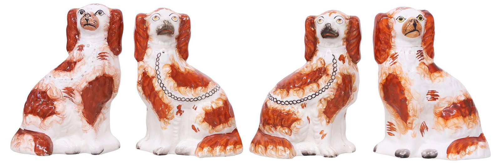 (4) ENGLISH VICTORIAN STAFFORDSHIRE MANTEL DOGS: (lot 4) English Victorian Staffordshire mantel dogs, late 19th c., comprising two pairs, each modeled as a seated spaniel, with liver-colored spots, and painted features, including: (2) with remnants 