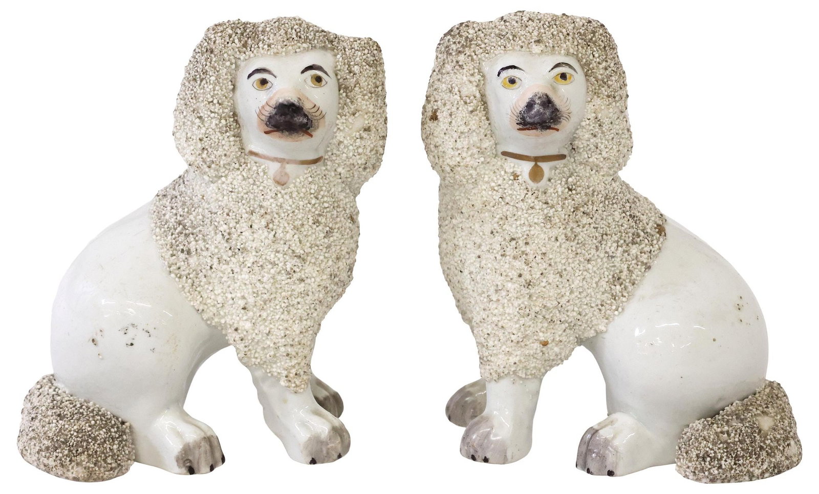 (2) ENGLISH VICTORIAN STAFFORDSHIRE FRITWARE MANTEL DOGS: (pair) English Victorian Staffordshire mantel dogs, late 19th c., each modeled as a seated spaniel, with painted features, frit textured fur at head and tail, remnants of gilt decoration, approx 5.5"h