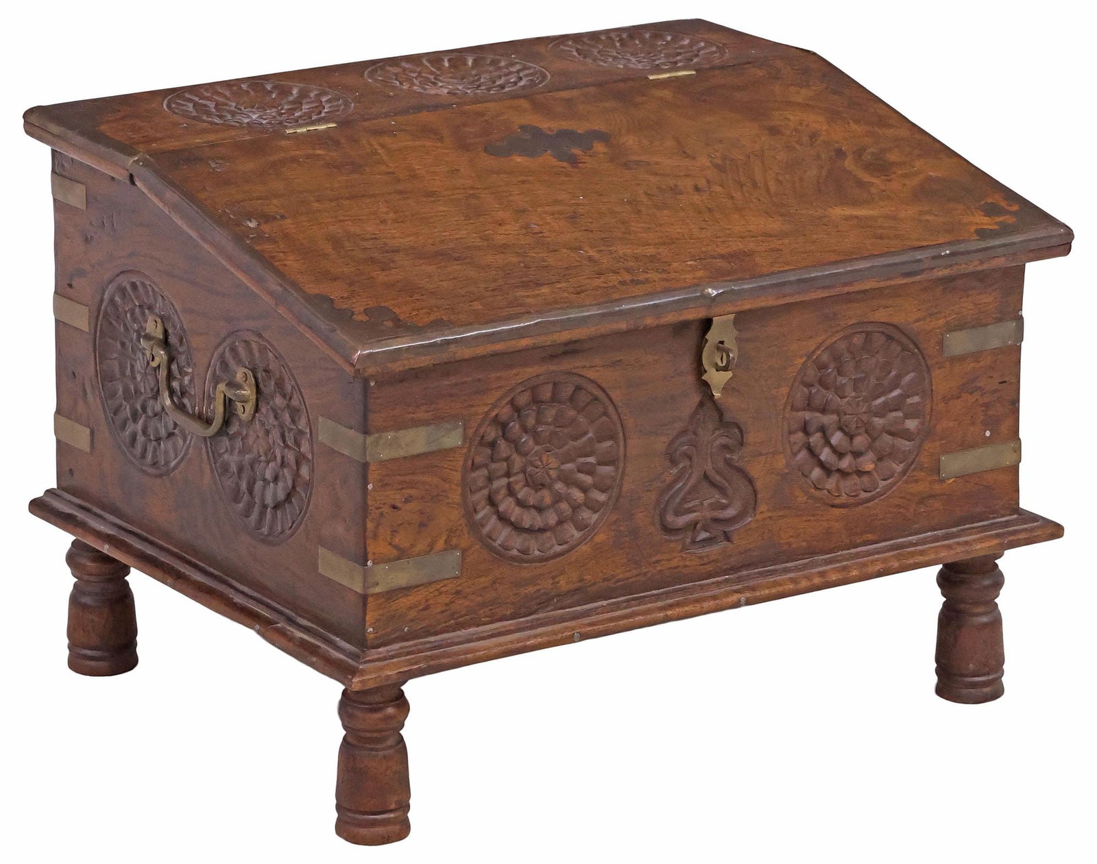 LARGE BRITISH COLONIAL STYLE ROSETTE CARVED DOCUMENT CHEST / BOX: British Colonial style brass-bound hardwood document chest/ box, 20th c. carved rosettes line the slanted lid, opening to compartmentalized upper storage and open base, on turned legs, approx 15.5"h, 
