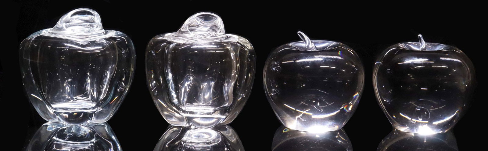 (4) TIFFANY & CO. ART CRYSTAL APPLE FORM JAM JARS & PAPERWEIGHTS: (lot of 4) Tiffany & Company crystal table accessories, each one with etched mark underfoot, including: (2) apple-form paper weights, approx 3.5"h, 3.5"diam, (2) apple-form jam jar, designed by Elsa P
