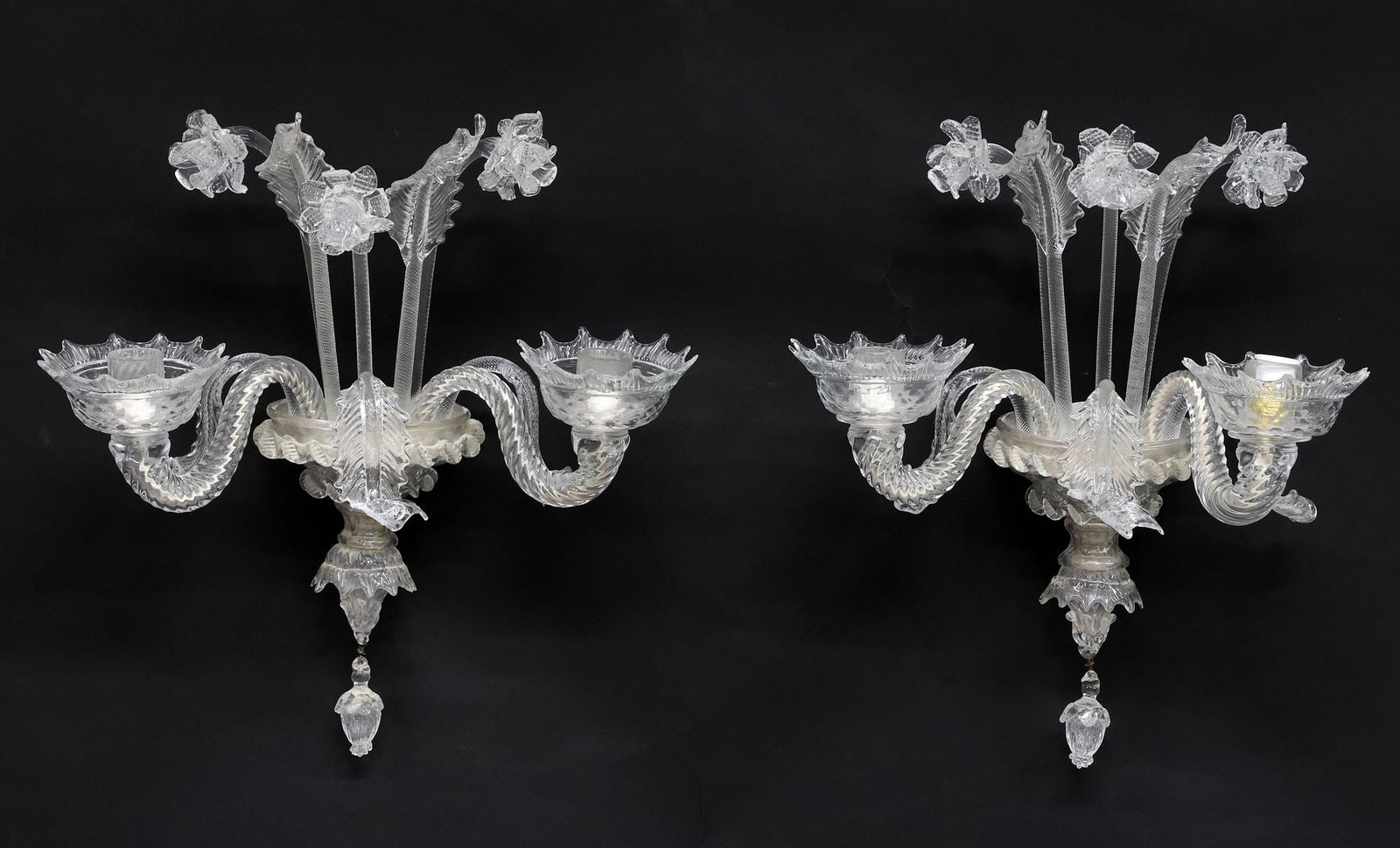 (2) ITALIAN CRISTALLERIA MURANO (ATTRIB.) 'CASANOVA' TWO-LIGHT WALL SCONCES: (pair) Italian art glass two-light wall sconces, attributed to Cristalleria Murano, 20th c., in the "Casanova" pattern, with raised floral motifs, twisted arms ending in floriform bobeches, and lower 