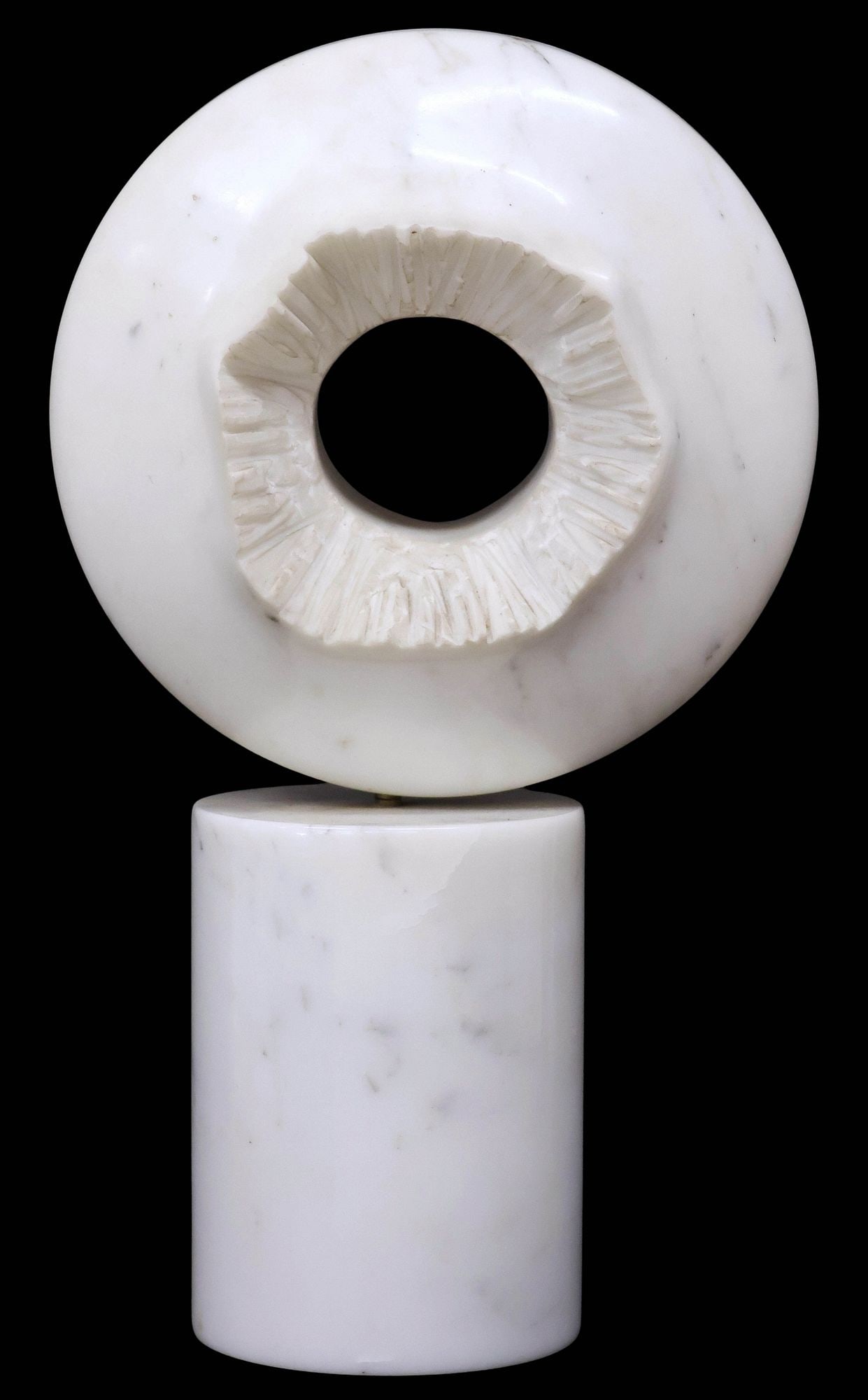 CARVED MARBLE ABSTRACT MAQUETTE SCULPTURE, DISC ON PEDESTAL, 23.5"H: Large carved marble abstract sculpture, Exploding Disc, in the form of a round ring with textured center, rising on smooth columnar pedestal, apparently unsigned, disc sits slightly askew on base, app