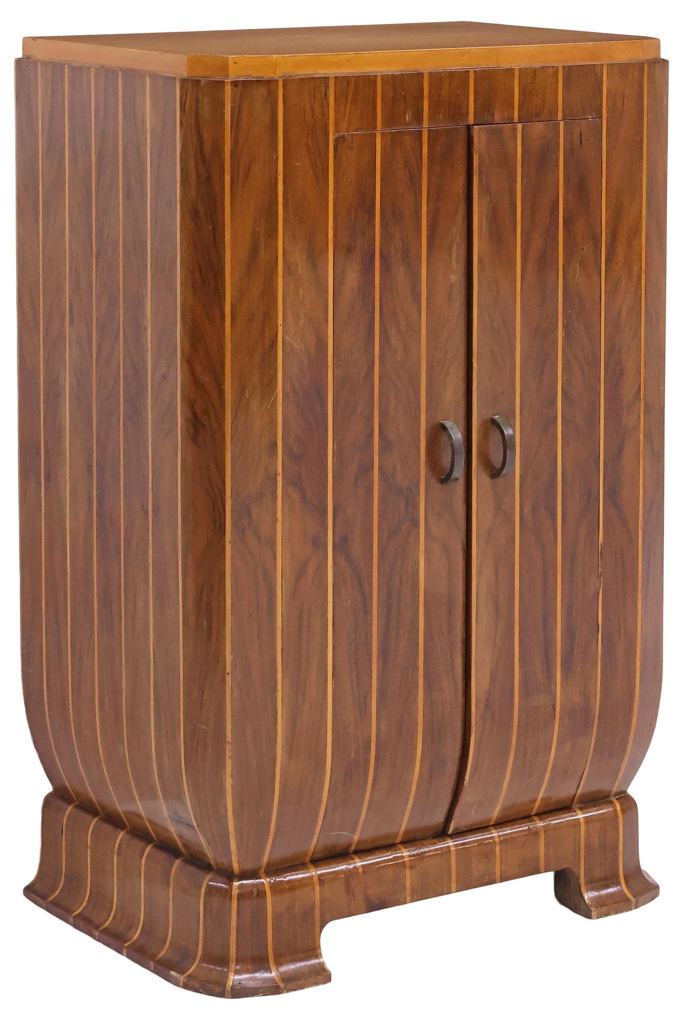 ITALIAN ART DECO PERIOD INLAID WALNUT CABINET: Italian Art Deco figured walnut cabinet, c.1930s, shaped case with canted angles, inlaid with vertical banding, fitted with pair of narrow doors, enclosing fixed-height shelving, on conforming plinth