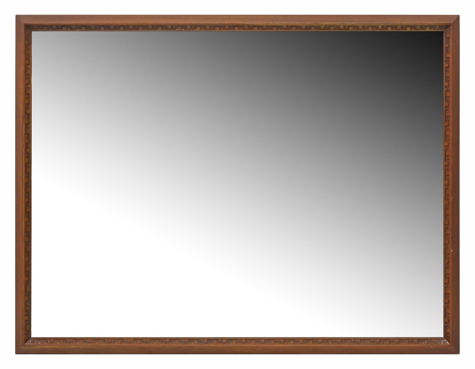 FRANK LLOYD WRIGHT FOR HENREDON 'TALIESIN' MID-CENTURY MIRROR: Mid-century modern mahogany "Taliesin" wall mirror, Frank Lloyd Wright (American, 1867-1959) for Heritage Henredon, c.1950s, rectangular frame with incised fretwork trim, encasing flat mirro
