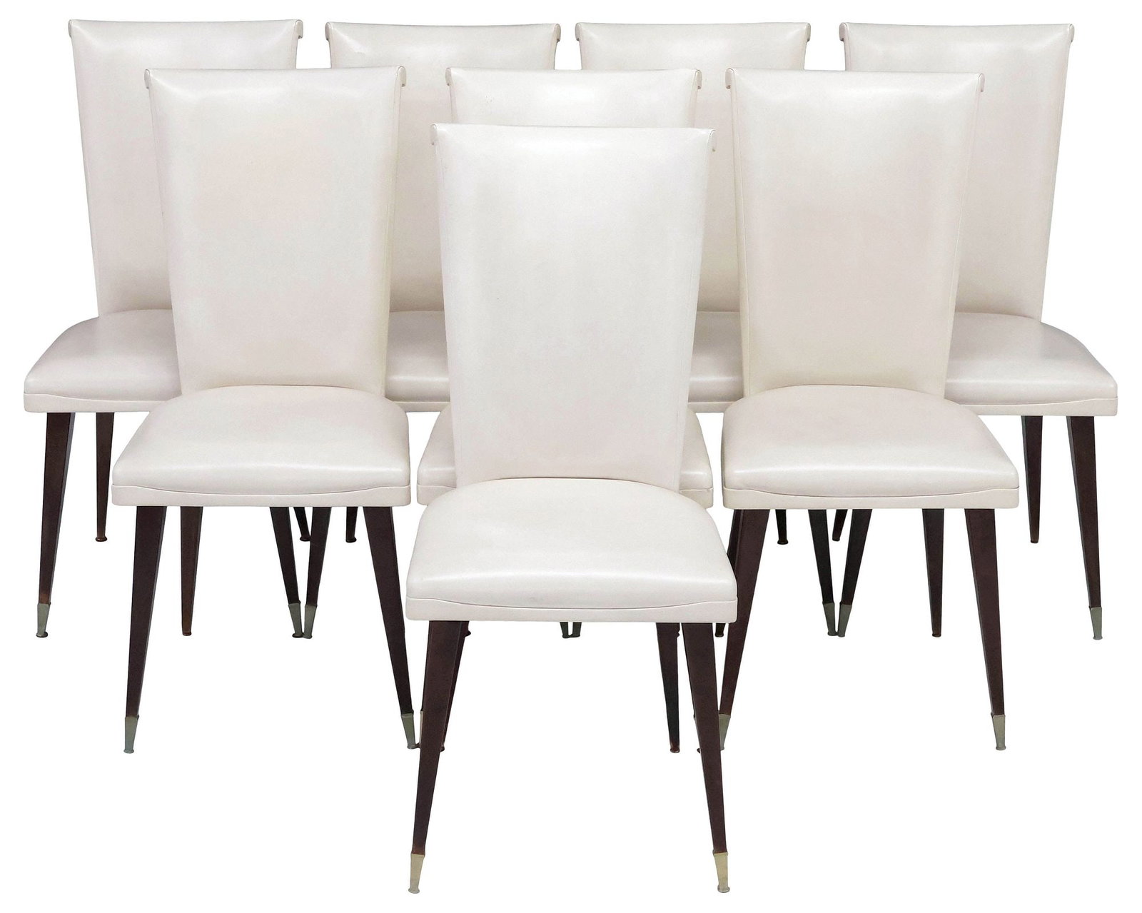 (8) ITALIAN MID-CENTURY MODERN UPHOLSTERED DINING CHAIRS: (lot of 8) Italian mid-century modern dining chairs, c.1960s, tapered back and padded seat in an ivory faux leather upholstery, tapered square legs ending on brass cap feet, approx 38.5"h, 18"w, 20"d,