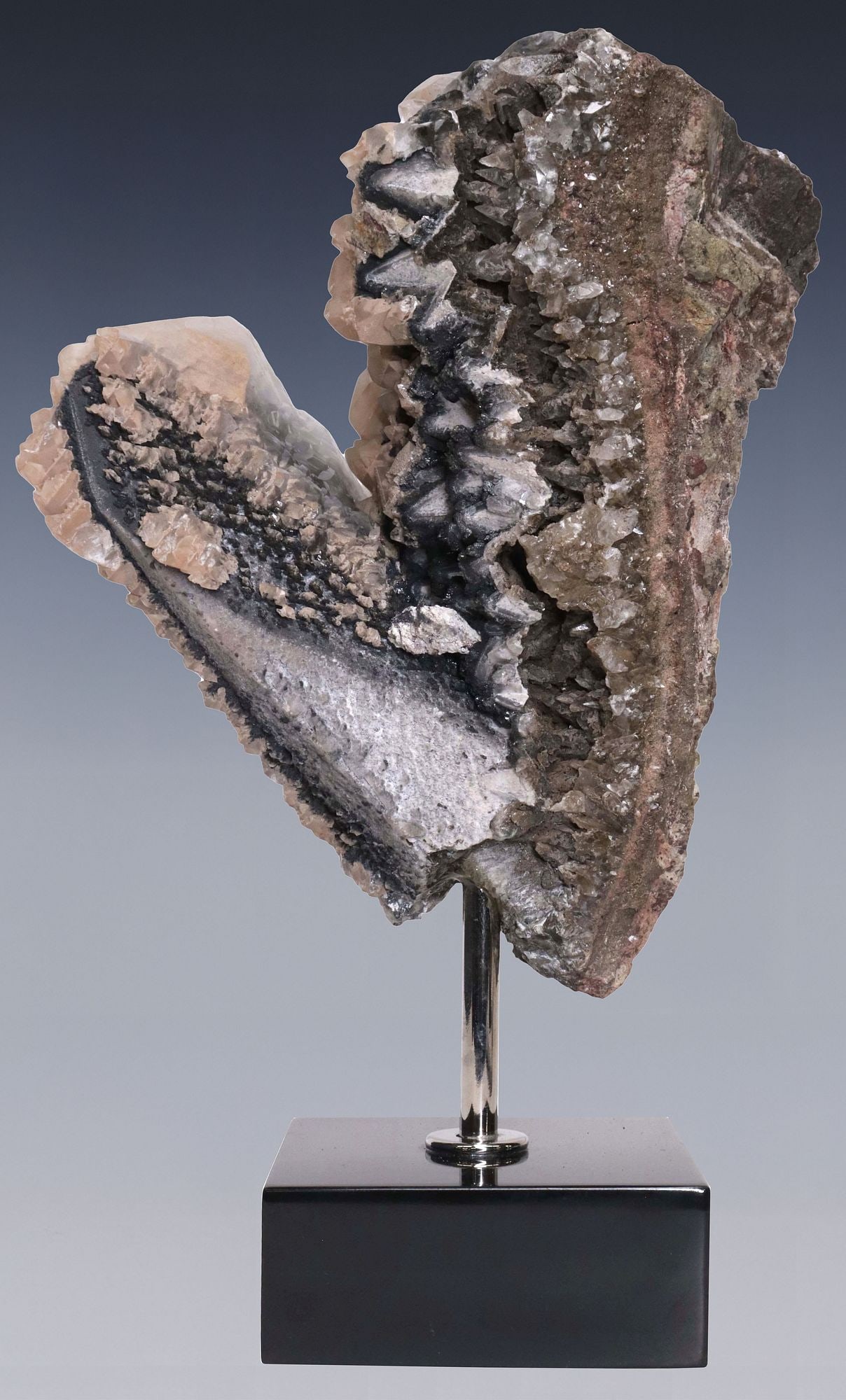 GEOLOGICAL CALCITE CLUSTER SPECIMEN ON MARBLE BASE: Geological calcite cluster, on polished nickel rod and black marble base, specimen: approx 9"h, 7.75"w, 3"d, overall: approx 12.5"h, 7.5"w, 4"d, 9lbs