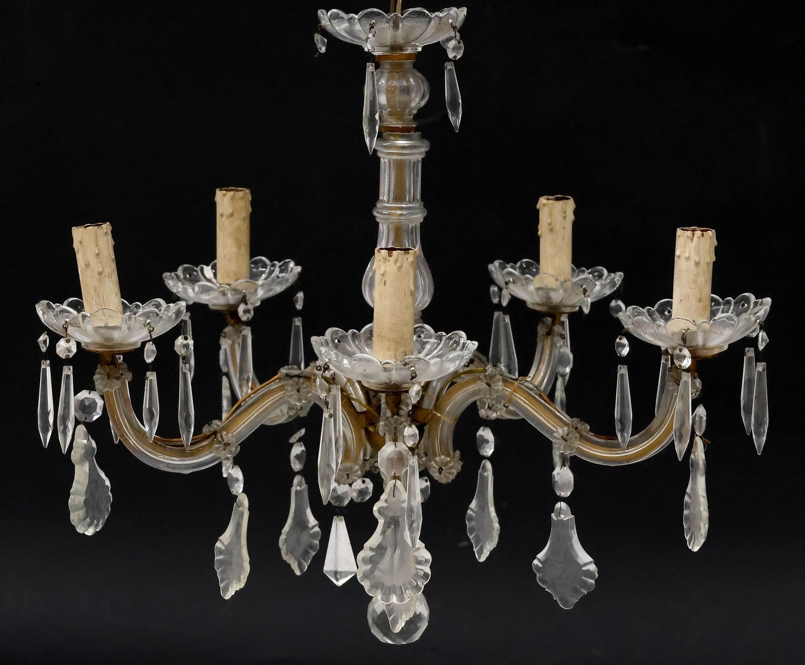 ITALIAN MARIA TERESA STYLE 5-LIGHT GLASS-CLAD CHANDELIER: Italian Maria Theresa style five-light chandelier, 20th c., glass-clad scrolled frame, hung with crystal pendalogues and prisms, arms terminating at floriform bobeche with faux candlesticks, above fac