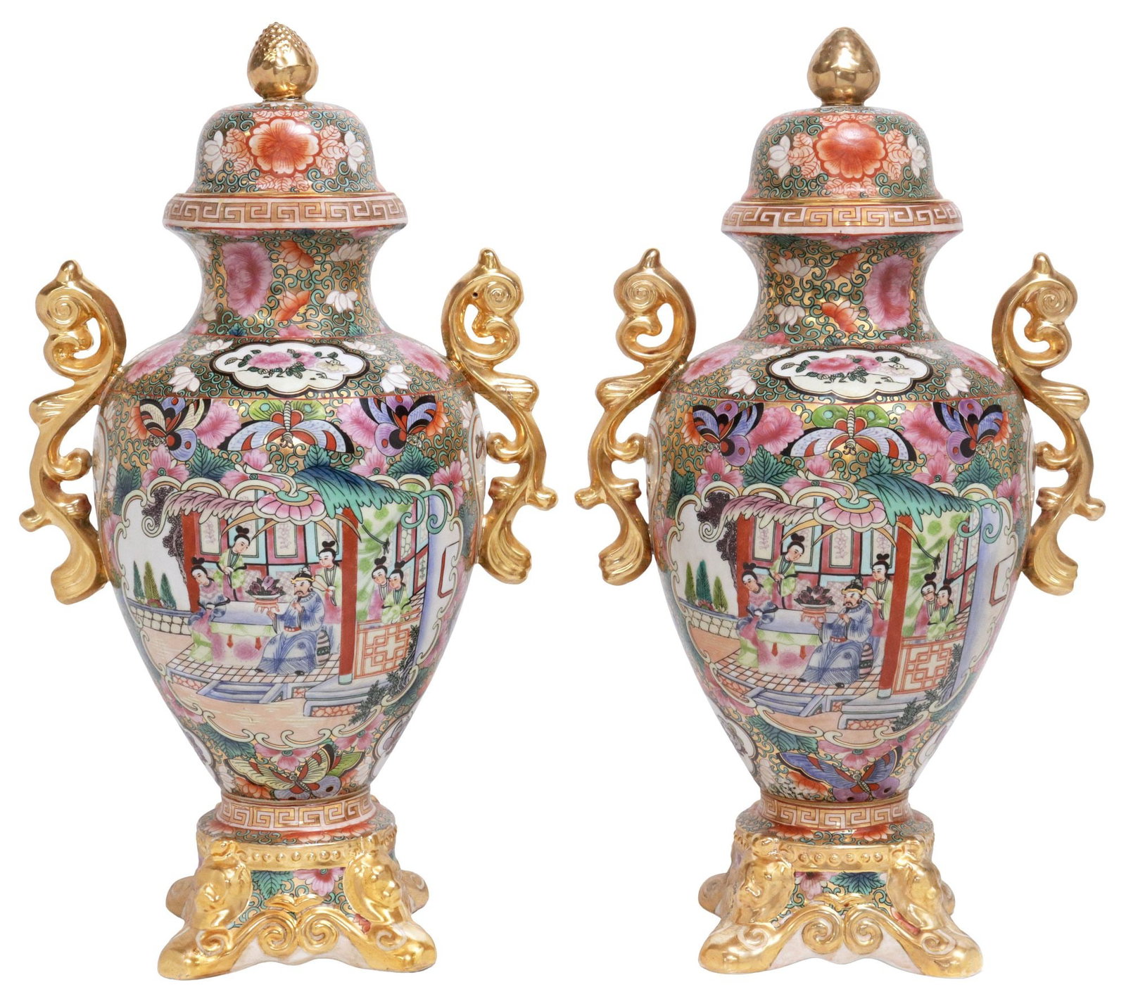 (2) DECORATIVE CHINESE FAMILLE ROSE COVERED PORCELAIN URNS ON STANDS: (pair) Chinese famille rose porcelain vases/ urns with lids, each having a domed cover with a gilt finial, central reserves with figural court scenes, honorific six-character mark underfoot, approx 18