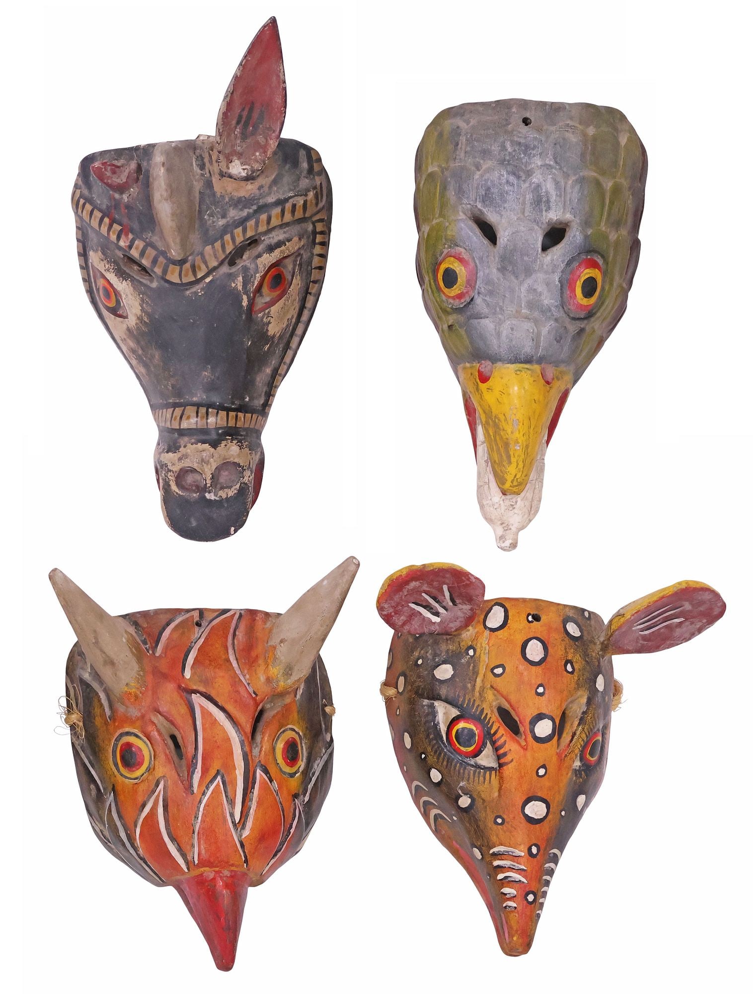 (4) MEXICAN FOLK ART CARVED & PAINTED ANIMAL DANCE MASKS: (lot of 4) Folk art carved and polychrome-painted dance masks, Guerrero, Mexico, mid 20th c., including: (1) bird with an ear of corn in mouth, (1) donkey/ burro with one ear, (1) spotted deer, (1) ho