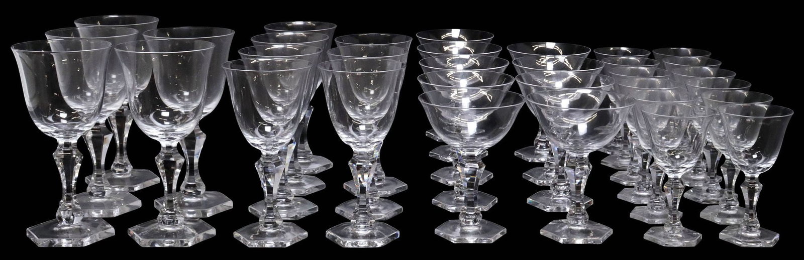 (33) KOSTA-BODA COLORLESS STEMWARE, WINE & CHAMPAGNE / SHERBET: (lot of 33) Kosta-Boda colorless stemware, all with etched mark underfoot, including: (12) port wine glasses, approx 4.75"h, 2.5"diam; (9) champagne/ tall sherbet glasses, approx 5"h, 3.75"diam; (7) w