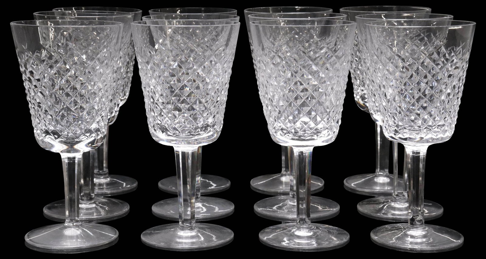 (12) WATERFORD 'ALANA' CUT CRYSTAL WATER GOBLETS: (lot of 12) Waterford cut crystal water goblets, in the "Alana" pattern, with multi-sided stem, each with acid-etched mark underfoot, approx "7, 3 3/8"diam, 11lbs total **Provenance: The collection of